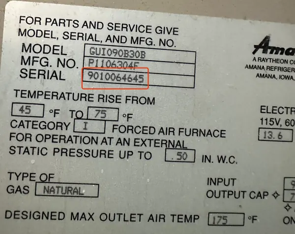 Data plate on an Amana furnace, serial number 9010064645 outlined in red