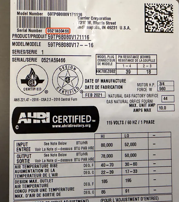 Data plate on a Carrier furnace, serial number 0521A59466 outlined in red