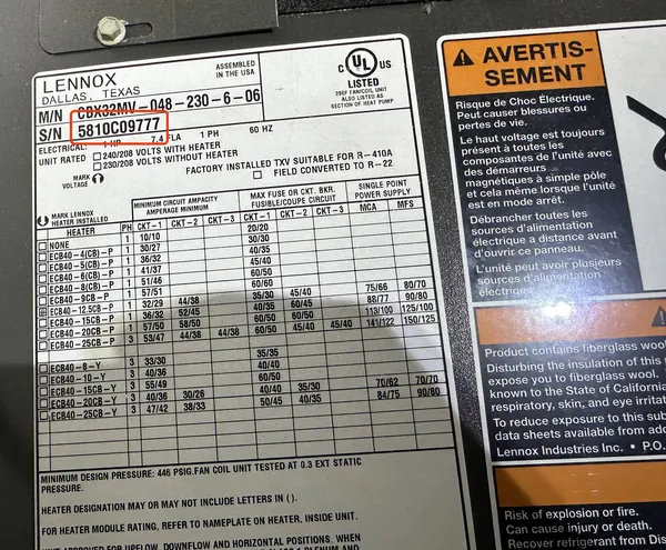 Data plate on a Lennox air handler, serial number 5810C09777 outlined in red