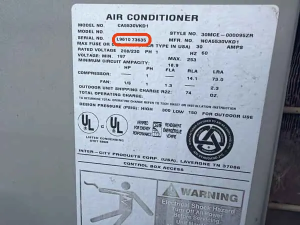 Data plate on a Tempstar air conditioner, serial number L961073635 outlined in red