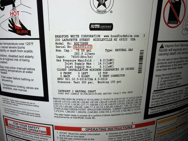 Rating plate on a Bradford White gas water heater, serial number ZL52501103 outlined in red