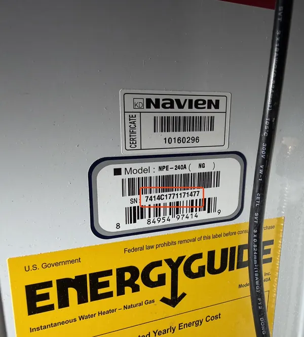 Rating plate on a Navien tankless water heater, serial number 7414C1771171477 outlined in red