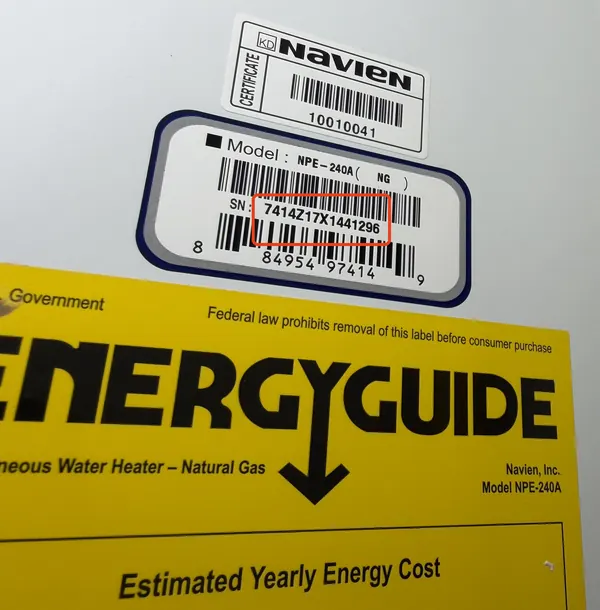 Serial number sticker on the side of a Navien tankless water heater, serial outlined in red